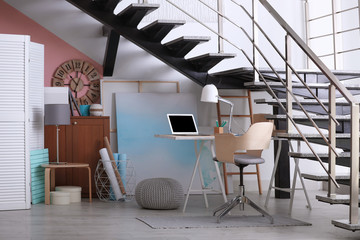 Wall Mural - Stylish room interior with modern workplace near stairs