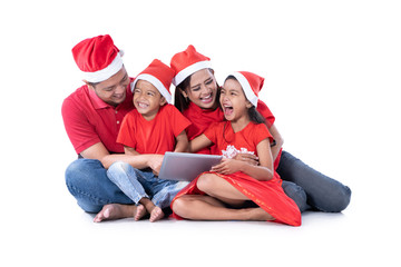 christmas family sitting over white background