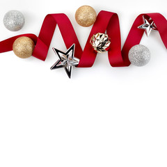 Christmas red ribbon decorate with silver glitter ornament balls and star on white background