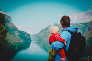 happy father with little daughter travel in nature