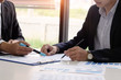 © Prathankarnpap - Business consult with finance report.