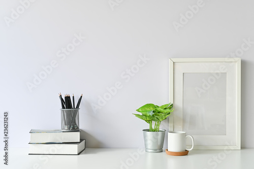Fotografía Office stuff with object supply books, coffee mug, pencil, photo frame and workspace table