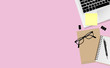 © jintana - Laptop computer with office supplies on pink color background with copy space, top view. Vector illustration