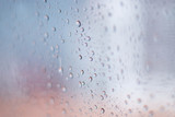 Fototapeta Tęcza - raindrops on the transparent glass