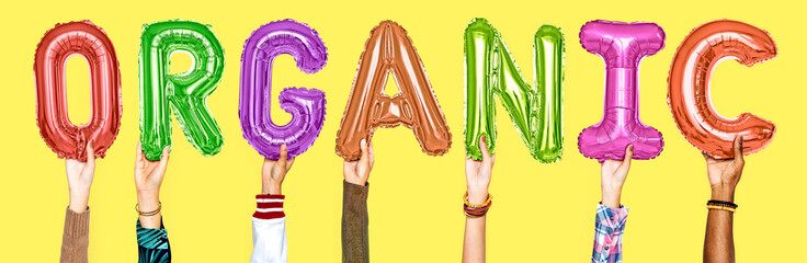 Canvas Print - Hands showing organic balloons word