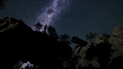 4K Astrophotography star trails over sandstone canyon walls