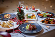 Romantic dinner setup or Holiday table setting. Many varied delicacies. Festive mood