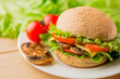 © Тетяна Шустик - Vegetarian burger with fresh salad on the plate, close up