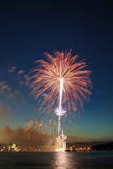 Colorful firework bursting over the river