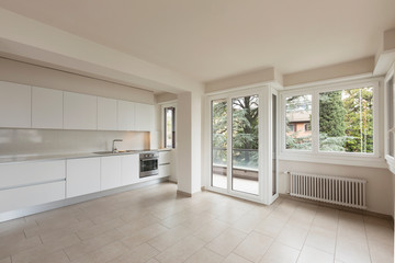 Open space with large windows and modern kitchen