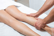 © LIGHTFIELD STUDIOS - cropped view of man massaging woman legs in spa center