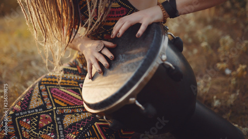 Beautiful Young Hippie Woman With Dreadlocks Playing On