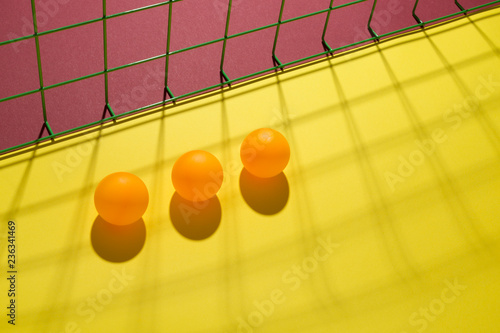 Fotografía Abstract still life with orange balls and mesh