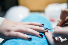Using The Nail Drill At THe Manicure Saloon