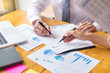© snowing12 - Business team data analyzing income charts document during discussion explain strategy meeting. on start-up project teamwork together.