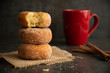 Bite out of breakfast donuts with coffee