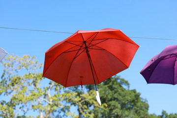 Red umbrellas as landscape decoration and shade