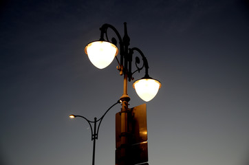 Silhouette of street lamp at dust