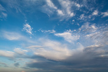 White Curly Clouds In A Blue Sky. Sky Background