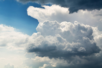 Wall Mural - white curly clouds in a blue sky. sky background