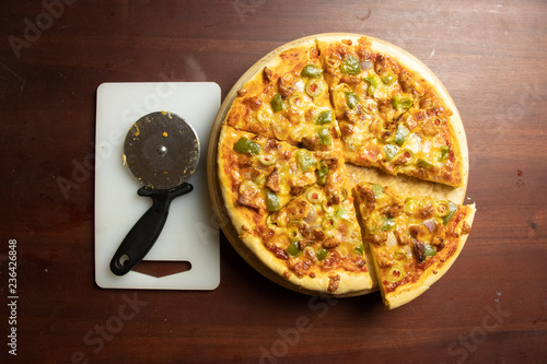 Pan Pizza Slice With Cutter Top Side View With Dark Brown Wood Stock Photo Adobe Stock