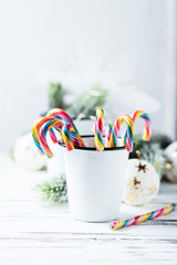 Poster - Christmas decoration with sugar candy on white table, selective focus