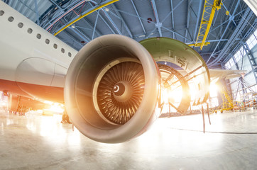 Poster - Turbine engine blades during maintenance, the plane in the hangar.