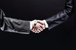 © yurolaitsalbert - close up. handshake business partners.isolated on black backgrou