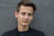 © Westend61 - Portrait of skeptical teenage boy