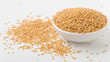 Golden flaxseed in bowl with flaxseed on white background