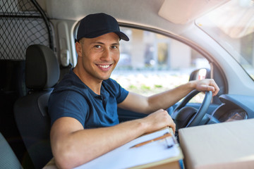 Wall Mural - Delivery man sitting in a delivery van