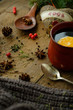 © sipcrew - Details of still life in the living room home interior. Beautiful cup of tea with spices and sweaters on a wooden background. Cozy autumn-winter concept...