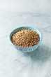 Organic Buckwheat in a Bowl on stone background. Healthy cooking with natural ingredients