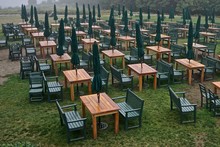 Acadia National Park, Maine, USA: Rows Of Tables And Benches And Folded Umbrellas On A Lawn, In The Rain, At The Jordan Pond House.