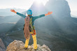© RG&B Images/Stocksy - Female alpinist with arms outstretched on top of the mountain