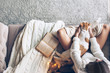© Alena Ozerova - Girl with cat relaxing on a couch