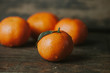© Giada Canu/Stocksy - Tangerine on wooden background