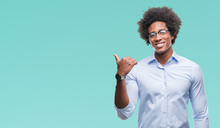 Afro American Business Man Wearing Glasses Over Isolated Background Smiling With Happy Face Looking And Pointing To The Side With Thumb Up.