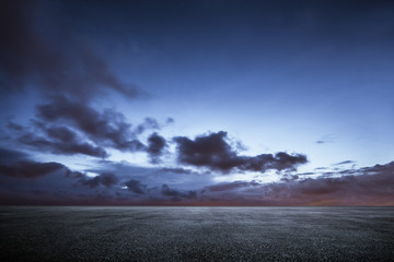 Wall Mural - empty asphalt floor with dramatic sunset sky .
