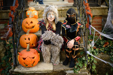 Two Children Dressed As A Bear And A Ninja For Halloween Show Of