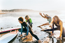 Three Teenage Friends And Their Surf Teacher
