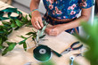 © Daxiao Productions/Stocksy - creative woman making christmas decorations