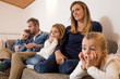 © Mauro Grigollo Photographer/Stocksy - Lovely Family watching tv at home