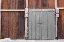 Big Wooden Door And Rusted Zinc Wall