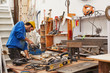 © ALTO IMAGES/Stocksy - Male worker using machinery on wood in workshop