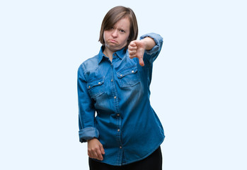 Sticker - Young adult woman with down syndrome over isolated background looking unhappy and angry showing rejection and negative with thumbs down gesture. Bad expression.