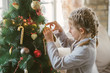 © Aleksandra Jankovic/Stocksy - Little Girl Decorating Christmas Tree