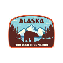 Alaska Badge Design. Mountain Adventure Patch. American Travel Logo. Cute Retro Style. Find Your True Nature Custom Quote. Bear Walking Through The Forest. Stock Emblem