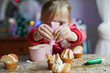 © sally anscombe/Stocksy - Child making cupcakes
