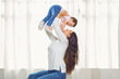 © Studio Romantic - Mother brunette plays with the child at home.
